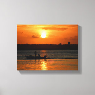 Toile Silhouette d'un bateau au coucher du soleil