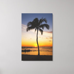 Toile Silhouette d'un palmier par un coucher du soleil
