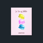 Toile "Sweet Essence of Life Personalized French Macaron<br><div class="desc">Célébrez la douceur de la vie avec notre "Sweet Essence of Life" Imprimé sur toile personnalisée, avec une délicieuse aquarelle de peinture de macarons français (macarons). Cette oeuvre élégante présente un ensemble de macarons aux teintes jaunes, roses et bleues douces, posés contre un charmant arrière - plan rose, qui incarne...</div>