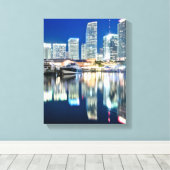 Toile View of skyline with reflection in water, Miami (Insitu (Plancher de Bois))