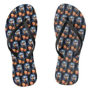 Tongs Airedale d'Halloween avec citrouilles effrayant