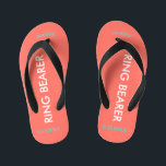Tongs Enfants NOM du porteur de bague Coral<br><div class="desc">Le Porteur de Bague est écrit en blanc contre la couleur de corail brillant avec des accents noirs. Le nom et la date du Mariage sont bleu turquoise. Personnalisez le nom de votre petit ours en majuscules voûtées. Cliquez sur Personnaliser pour augmenter ou diminuer la taille du nom pour entrer...</div>