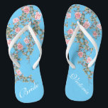 Tongs Fleurs roses florissantes Bride Mariage Bleu<br><div class="desc">Les flops présentent une florissante illustration de fleurs roses sur un arrière - plan bleu vif et une typographie classique de mots mariages. Cette belle paire de tongs élégants serait un quelque chose de beau bleu pour un mariage de printemps ou d'été. customisez-le avec votre texte à l'aide des champs...</div>