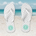 Tongs Gray et Aqua Chevron Monogram<br><div class="desc">Des sandales à tongs imprimées sur mesure avec un motif chevron moderne et élégant et votre monogramme ou autre texte personnalisé dans un cadre circulaire. Cliquez sur Customiser pour modifier les polices de texte et les couleurs ou ajouter vos propres images pour créer un design unique et unique !</div>