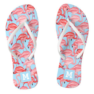 Tongs Les Flamants roses roses lumineux sur le bleu