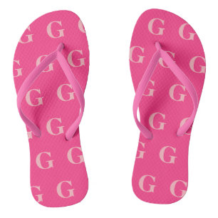Tongs Monogrammes rose doux sur Arrière - plan Fuchsia