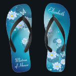 Tongs Turquoise bleu floral motif matron d'honneur flip<br><div class="desc">Ce joli quelque chose de bleu présente d'élégantes fleurs de lotus sur l'arrière - plan bleu turquoise dégradé. Ajoutez votre libellé pour créer facilement vos propres tongs mariages, pour ajouter une dose élégante de glam à votre jour de mariage, de fête de bachelorette ou autre célébration. customisez-le avec votre libellé...</div>