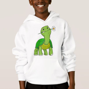 Tortue avec fleur de marguerite