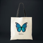 Tote Bag Belle aquarelle bleue 3D papillon<br><div class="desc">Créez vos propres sacs fourre-tout de papillons personnalisés sur un modèle do-it-yourself élégant qui est facile d'ajouter votre lettre monogramme, nom, initiales ou courte phrase/citation inspirante à. L'aquarelle rustique illustrée par les artistes Raphaela Wilson met en valeur un beau papillon monarque bleu avec une ombre sous ses ailes à motifs...</div>