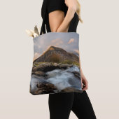 TOTE BAG BROWN MOUNTAIN NEAR BODY OF WATER UNDER CLOUDY SKY (De près)
