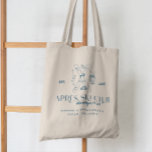 Tote Bag Champagne sur glace | Après Ski Winter Bachelorett<br><div class="desc">Célébrez votre enterrement de vie de jeune fille avec style avec ces sacs à main Après Ski chic, parfaits pour les escapades hivernales et les aventures enneigées ! Avec un design élégant et ludique comprenant des skis croisés, des flûtes à champagne et des flocons de neige, ces sacs ajoutent une...</div>