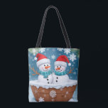 Tote Bag Christmas Snowman Couple<br><div class="desc">Ce charmant sac fourre-tout comprend deux mignons bonhommes de neige avec leurs joues roses et le nez de carottes. Ils s'assoient doucement dans un bain de glace, rayonnant une aura de camaraderie joyeuse. Portez une touche d'émerveillement hivernal où que vous alliez et laissez ces enneigeurs attachants être vos compagnons dans...</div>