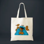 Tote Bag Cookie Monster Eating All the Cookies<br><div class="desc">Satisfy your cravings for fun and cookies with this graphic featuring the one and only Cookie Monster! This showcases a vibrant illustration of Cookie Monster in his element, happily devouring a pile of chocolate chip cookies with crumbs flying everywhere. This classic and instantly recognizable design is cheerful, playful, and sure...</div>