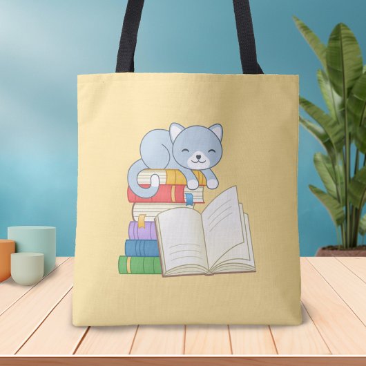 Tote Bag Cute Chat au-dessus d'une pile de livres