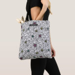 Tote Bag Daisies Neon Motif<br><div class="desc">Motif avec illustrations de marguerites noires et blanches aux centres colorés. Personnalisez avec nom sur rectangle gris au sommet.</div>