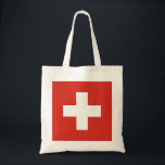 Tote Bag Drapeau Suisse - croix blanche<br><div class="desc">Le drapeau suisse est constitué d'un drapeau rouge avec une croix blanche au centre. Le drapeau suisse de couleur rouge est idéal pour les événements sportifs, le décor de maison, les restaurants, les bars et les voyages. Le texte peut être ajouté ou supprimé et les tailles peuvent être modifiées. #suisse...</div>