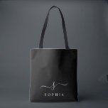 Tote Bag Élégant Monogramme Noir Blanc Minimaliste Moderne<br><div class="desc">Personnalisez ce sac fourre-tout élégant avec votre monogramme initial. Le design présente un monogramme personnalisé simple dans une typographie minimaliste moderne classique en blanc sur fond noir. Facile à personnaliser. Parfait comme cadeau pour tous vos proches. Prenez-en un pour vous aussi.</div>