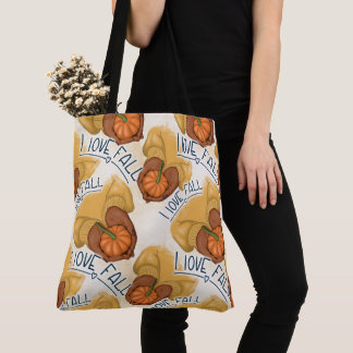 TOTE BAG FEMME EN PULL OR TENANT UNE PETITE CITROUILLE