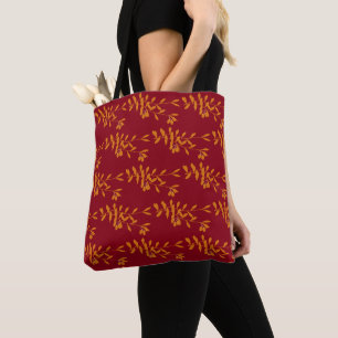 Tote Bag Feuilles de branches de silhouette orange sur roug