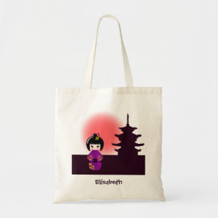 Tote Bag Japanese kokeshi doll at temple during sunset