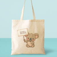 Koala mignon tenant un panneau de nom