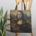 Tote Bag Meow Lisa<br><div class="desc">The Meow Lisa Sac fourre-tout - Vous vous êtes déjà demandé quelle est la raison de ce sourire mystérieux de Mona Lisa ? En deuxième lecture, nous avons la réponse. Ce chef-d'oeuvre absolu d'un sac fourre-tout présente l'oeuvre d'art la plus connue du monde "brossant", et ayant un certain temps de...</div>