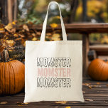 Tote Bag Momster Pink Halloween mignonne et Éffrayante !"<br><div class="desc">Portez vos produits essentiels Halloween avec style avec notre Sac fourre-tout "Momster" Pink Halloween ! Parfait pour les mamans qui aiment embrasser la saison éffrayante avec une touche d'humour, ce sac fourre-tout présente le design "Momster" ludique en lettres éffrayantes et audacieuses sur un arrière - plan rose vif. Qu'il s'agisse...</div>