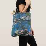 Tote Bag Nénuphars de Claude Monet, Impressionnisme Vintage<br><div class="desc">De beaux sacs fourre-tout tout-en-un ! Disponible en deux styles et deux tailles ! Nénuphar (1914) de Claude Monet est une peinture de nature impressionniste vintage. Une des nombreuses variations de peintures florales de nénuphars que Monet peint par l'étang dans son jardin fleuri à Giverny, France. À propos de l'artiste...</div>