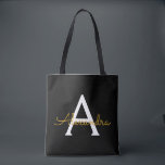 Tote Bag Noir Nom Gold White Girl Script Monogramme moderne<br><div class="desc">Black and Gold Elegant Ajoutez votre propre nom Monogram Book Bag. Ce sac de livre peut être customisé pour inclure votre nom initial et prénom et donné comme cadeau pour Noël,  Sweet 16 Anniversaire,  Fête des mariées ou Mariage.</div>