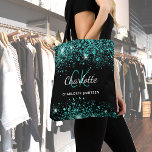 Tote Bag Noir turquoise vert parties scintillant monogramme<br><div class="desc">Un arrière - plan de couleur noire design. Décoré de poussière de parties scintillant turquoise et verte. Personnalisez et ajoutez votre prénom,  vos initiales monographiques et votre nom complet. Le nom est écrit avec un script de style écrit à la main.</div>