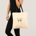 Tote Bag Nom du monogramme gris élégant Script manuscrit<br><div class="desc">Girly Stylish Modern Grey and Black Monogramme Nom initial Signature Script Custom Boutique personnalisée Sac fourre-tout budgétaire. Ce design avec un prénom dans un joli style lettré à la main typographie (ou calligraphie) avec monogramme initial en noir et gris sur blanc crème naturelle. Facile à customiser. Idéal pour cadeau de...</div>