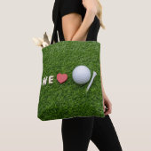 Tote Bag Nous aimons le golf avec une balle de golf et un t (De près)