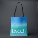 Tote Bag Océan Aquarelle Plage Bleu Vert<br><div class="desc">Cette conception de plage présente un texte en détresse sur un fond bleu et vert océan à l'aquarelle. Cliquez sur le bouton Personnaliser pour les options de modification ou d'ajout de texte ! Des variations de cette conception, des couleurs supplémentaires, ainsi que des produits coordonnés sont disponibles dans notre boutique,...</div>