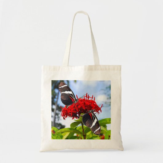 Tote Bag Papillons à ailes longues zébrées sur fleurs rouge (Devant)