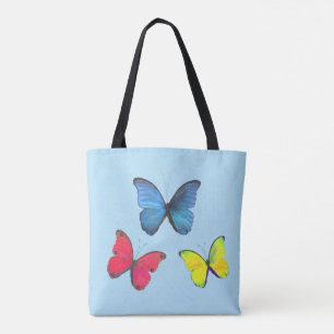 Tote Bag Papillons bleus rouges et jaunes sur fond bleu cla