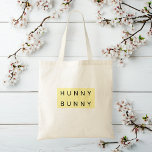 Tote Bag Pastel Jaune "Lapin Chanté" Mignonne Pâques<br><div class="desc">Emportez l'esprit de Pâques partout avec ce joli Sac fourre-tout de Pâques Pastel "Hunny Bunny" ! Doté d'un charmant design lapin et de teintes douces jaune pastel, ce fourre-tout est parfait pour la chasse aux oeufs de Pâques, les courses de printemps ou les cadeaux. Fabriqué à partir d’un tissu durable,...</div>