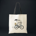 Tote Bag Peanuts | Snoopy & Woodstock Bicycle<br><div class="desc">Pedal into style and classic charm with this adorable cream canvas tote bag, featuring Snoopy and Woodstock on a bicycle! This fun tote showcases a delightful line-art illustration of Snoopy, wearing sunglasses, happily riding a vintage-style blue bicycle with Woodstock perched safely behind him. The dashed lines behind the back wheel...</div>