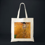 Tote Bag Portrait de Gustav Klimt<br><div class="desc">Cette peinture populaire de Klimt est intitulée "Portrait d'Adele Bloch-Bauer" et a été peinte en 1907. Gustav Klimt (14 juillet 1862 - 6 février 1918) était un peintre symboliste autrichien et l'un des membres les plus importants du mouvement de sécession de Vienne. Klimt est réputé pour ses peintures, ses peintures...</div>