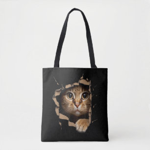 Tote Bag Regards de mignon chaton depuis le tissu déchiré C