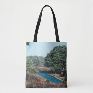 TOTE BAG ROAD SURROUNDED WITH TREE DURING DAYTIME