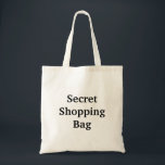 Tote Bag Secret Shopping<br><div class="desc">Le texte de ce "sac secret" est personnalisable.</div>