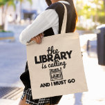 Tote Bag The Library Is Calling And I Must Go Reading Books<br><div class="desc">Un drôle de rat de bibliothèque qui dit sac fourre-tout qui dit : "La bibliothèque appelle et je dois y aller". Fait un grand cadeau pour les amateurs de lecture et de livre.</div>