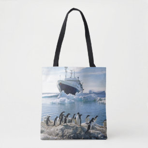 Tote Bag Un groupe de pingouins se tenant sur une plage