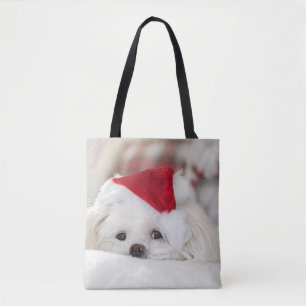 Tote Bag Un mignon chien blanc dans un Casquette de Noël ro