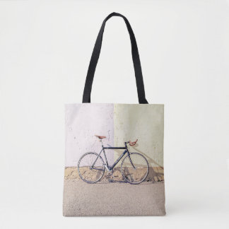 TOTE BAG VÉLO DE VILLE NOIRE ET GRIS S'APPUYANT SUR MUR BLA