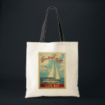 Tote Bag Vintage voyage de voilier du Cap May New Jersey<br><div class="desc">Ce Salutations From Cape May New Jersey design nautique de voyage vintage comprend un bateau naviguant sur l'eau avec des mouettes et un ciel bleu rempli de somptueux nuages blancs bouffants.</div>