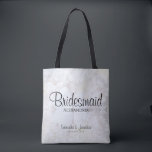 Tote Bag White Peony Flowers & Hearts Bridesmaid Mariage<br><div class="desc">Ce beau sac fourre-tout est parfait pour remercier vos demoiselles d'honneur. Il présente un script noir moderne en lettrage sur un arrière - plan de reflet des fleurs et des coeurs de pivoines blanches. Le texte est entièrement personnalisable et dit : Bridesmaid, avec un endroit pour son nom, les noms...</div>
