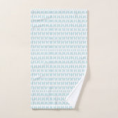 Towels with a light blue fish pattern hang neatly (Serviette à main)