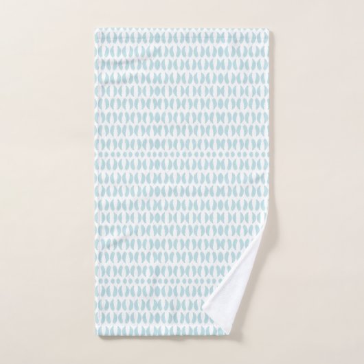 Towels with a light blue fish pattern hang neatly (Serviette à main)