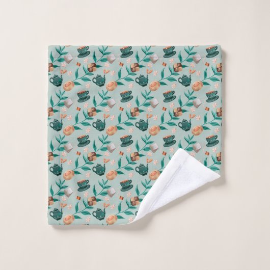 Towels with a teal floral pattern hang  (Gant de toilette)
